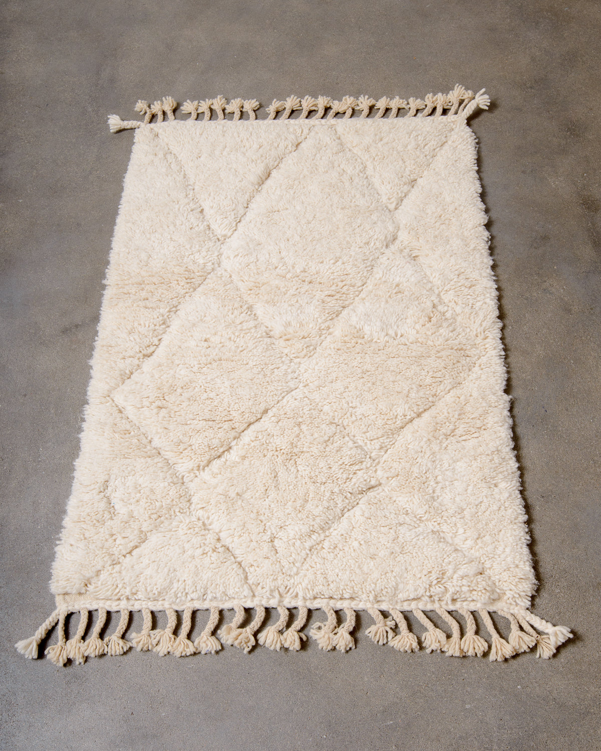 Modern, designer, handcrafted Berber rug from Morocco. Beniourain carpet with minimalist design, natural wool pile and a fluffy texture.
